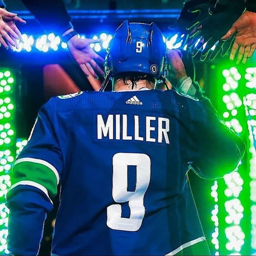 View from behind of a hockey player walking out to the ice | The Pint Vancouver